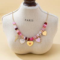 Pink Beaded Heart and Shell Charm Necklace | 80N92903